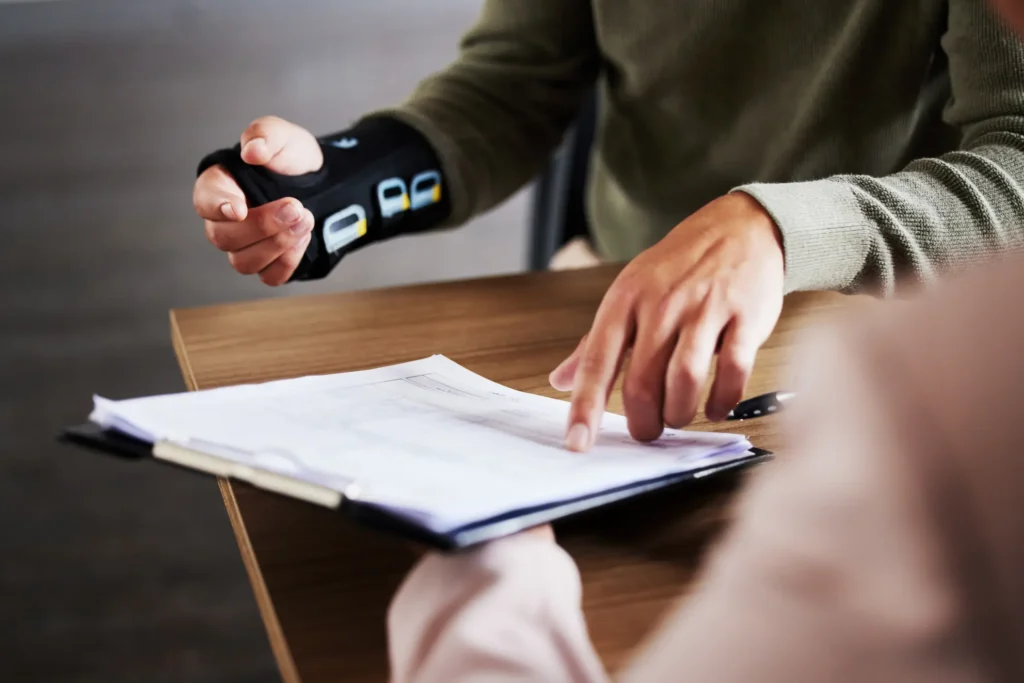 accident victim looking at insurance docs