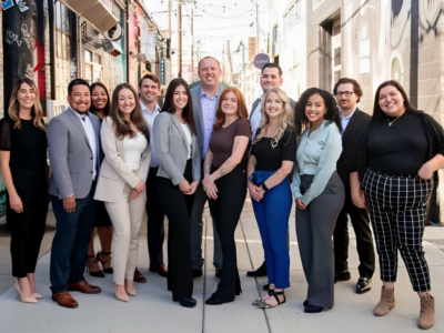 picture of the cgh team standing outside their office