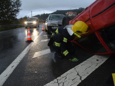 a rescuer checking the victims in a car accident on a highway