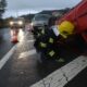 a rescuer checking the victims in a car accident on a highway