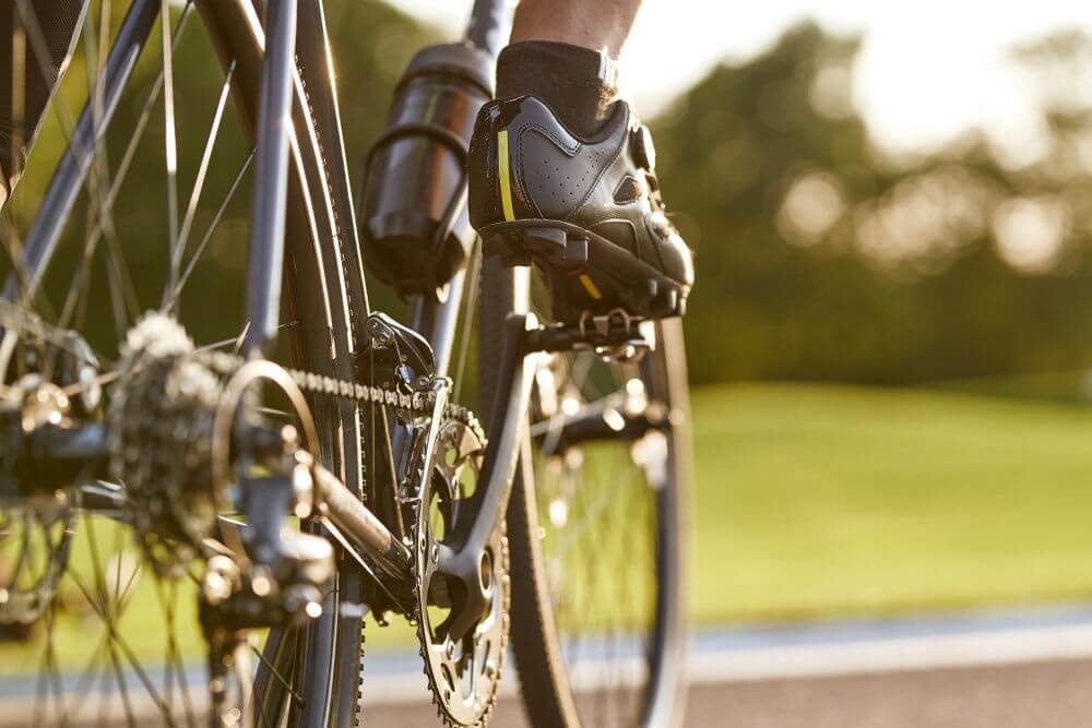 Person riding a bicycle, foot level - CGH Injury Lawyers