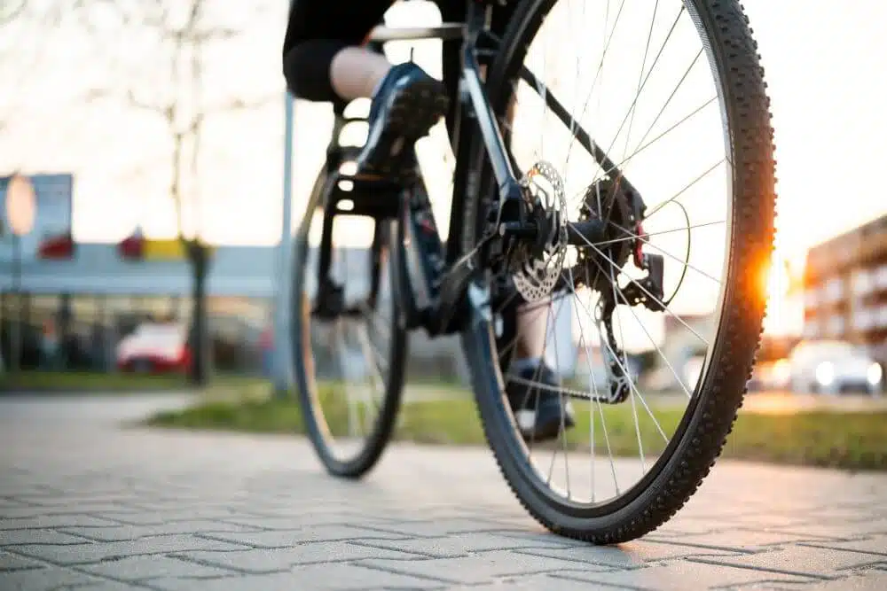 Low angle shot of a cyclist riding a bicycle - CGH Injury Lawyers