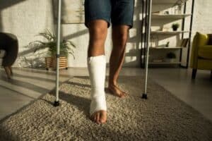 Person with a leg cast and crutches
